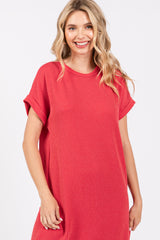 woman wearing a red ribbed oversized t-shirt dress with short sleeves