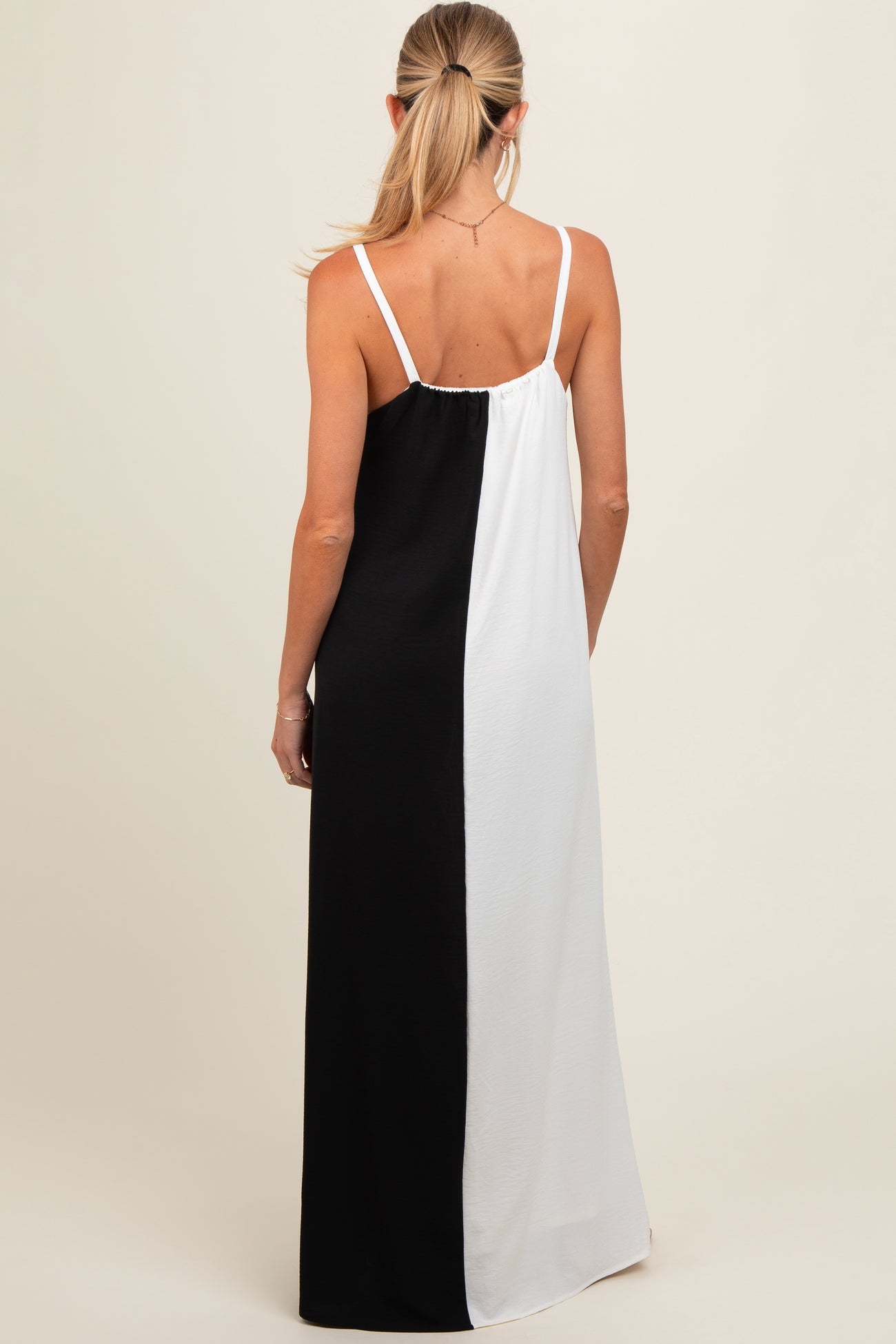 maternity wear black and white color block maxi dress with adjustable spaghetti straps