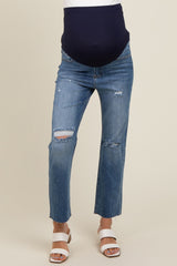 woman wearing distressed blue maternity jeans with a navy blue over-the-bump panel