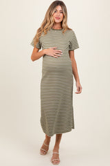 woman wearing a green and white striped maternity maxi dress, showcasing her baby bump