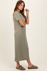 woman wearing an olive green and white striped midi dress with short sleeves and sandals