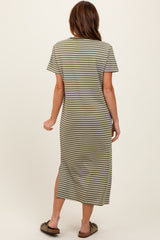 woman wearing an olive green and white striped short sleeve maxi dress with side slits