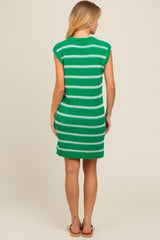 woman wearing a green and white striped sleeveless knit dress with a fitted silhouette