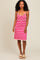 woman wearing a pink and white striped sundress with a crochet design and thin straps