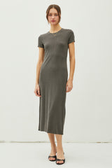 woman wearing a dark grey short sleeve ribbed midi dress and black heeled sandals