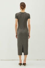 woman wearing a gray ribbed midi dress with short sleeves and a back slit detailing, view from the back