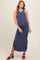 woman wearing a navy blue ribbed maternity maxi dress with side slits and a visible baby bump