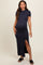 woman wearing a navy blue short sleeve maternity dress with a side slit and a visible baby bump
