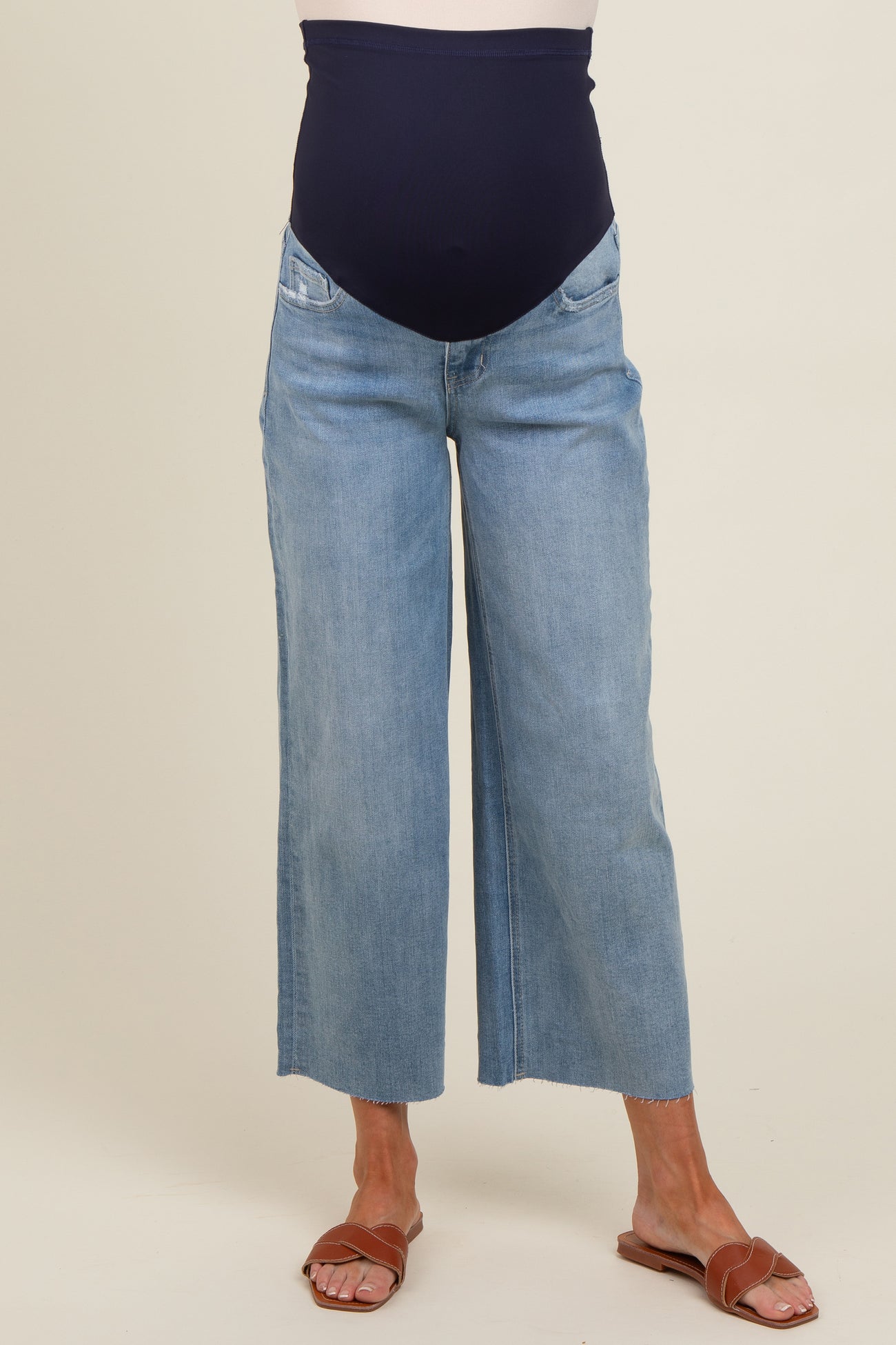 woman wearing light blue maternity wide-leg jeans with a navy over-the-bump panel
