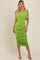 woman wearing a bright green off-the-shoulder midi dress with gathered detailing and a fitted silhouette