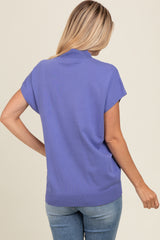 woman wearing a lavender short sleeve sweater with a relaxed fit, seen from the back