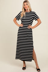 woman wearing a black and white striped maxi dress with short sleeves and side slits