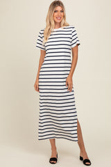 woman wearing a navy and white striped maxi dress with short sleeves and side slits