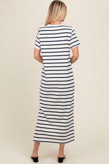 woman wearing a white and navy striped maxi dress with short sleeves, seen from the back