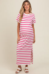 woman wearing a white and pink striped maternity maxi dress with a side slit and short sleeves, showing her baby bump