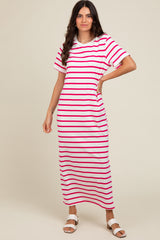 woman wearing a pink and white striped maxi dress with short sleeves and a relaxed fit