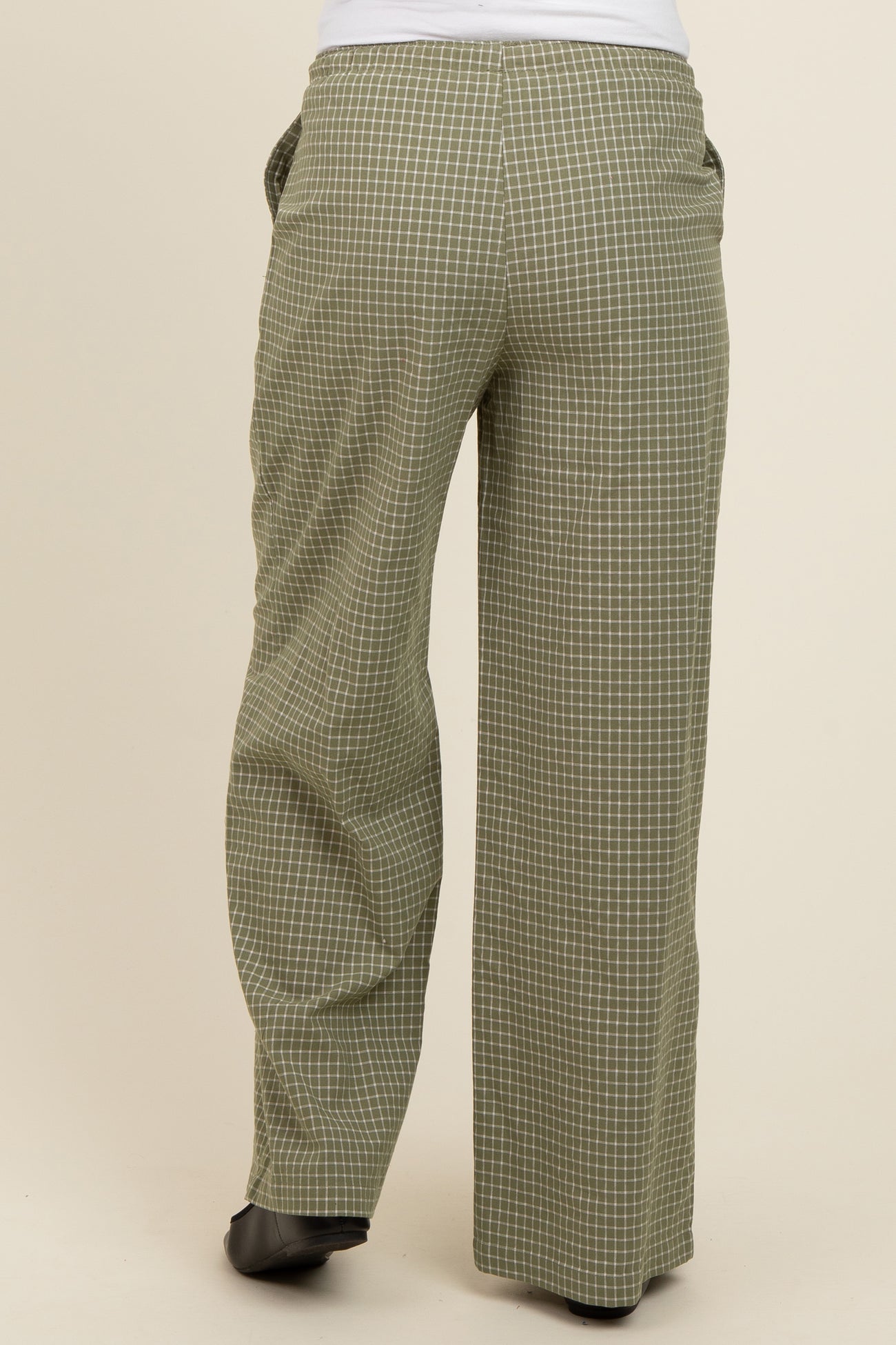 wide leg maternity pants in olive green with a checked pattern, shown from the back