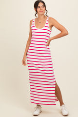 woman wearing a white and pink striped maxi dress with a side slit and casual sneakers