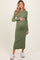 woman wearing a green ribbed maternity dress with long sleeves and a baby bump