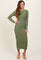 woman wearing a long sleeve olive green ribbed knit midi dress and beige heeled sandals