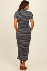 woman wearing a gray striped maternity maxi dress, showing the back view and a fitted style