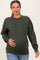 woman wearing a dark green maternity sweatshirt and holding her baby bump