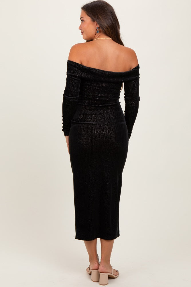 woman wearing a black off-the-shoulder maternity dress with long sleeves and a fitted midi length