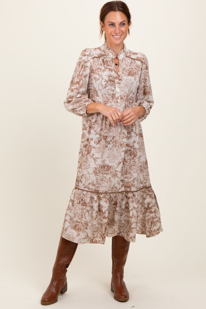 woman wearing a brown floral midi dress with a button-down front and ruffled hem, paired with brown knee-high boots