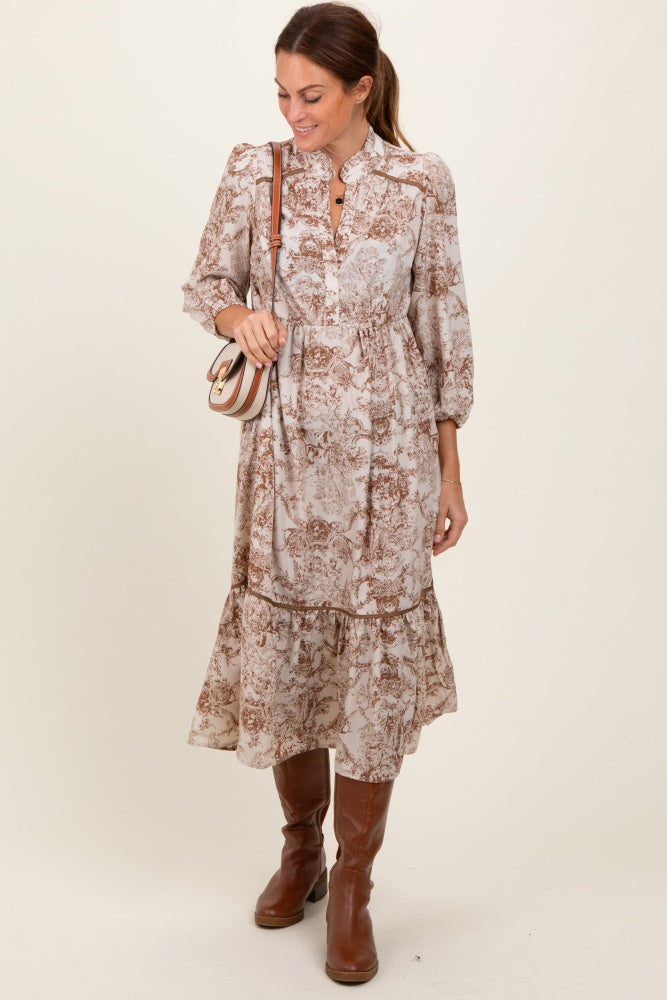woman wearing a brown floral print midi dress with puff sleeves and a tiered skirt, accessorized with a small crossbody bag