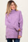 woman wearing a light purple maternity sweater with a turtleneck and side slits