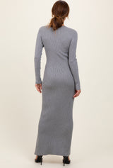 woman wearing a form-fitting gray ribbed maxi dress with long sleeves, viewed from the back