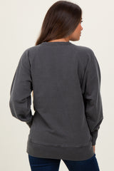 woman wearing a dark gray maternity sweatshirt with raglan sleeves, viewed from the back