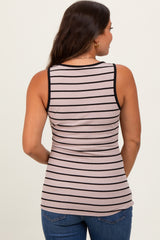 woman wearing a striped maternity tank top in pink and black, showing a snug fit and a baby bump
