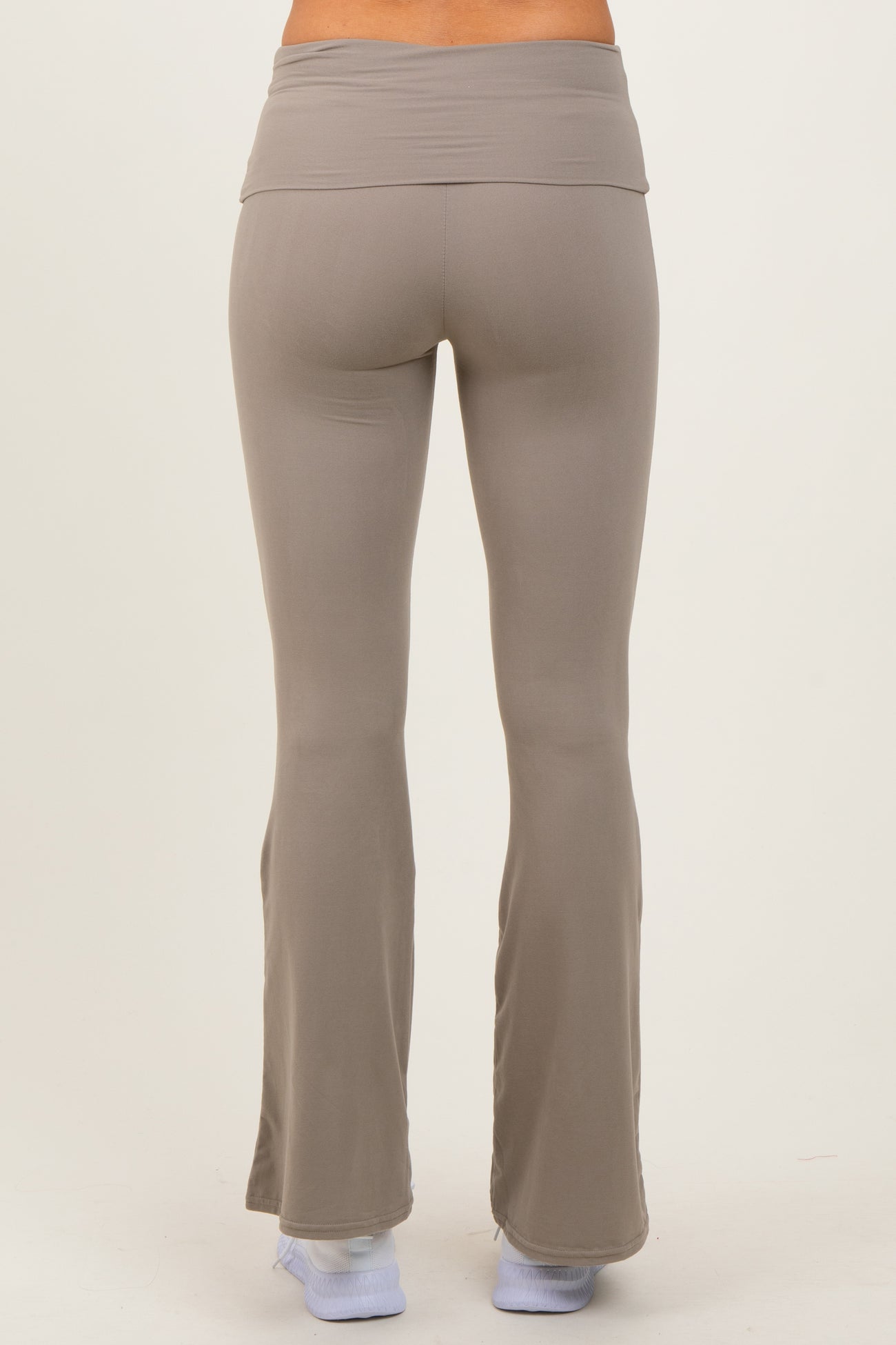 woman wearing light gray flared workout leggings viewed from the back
