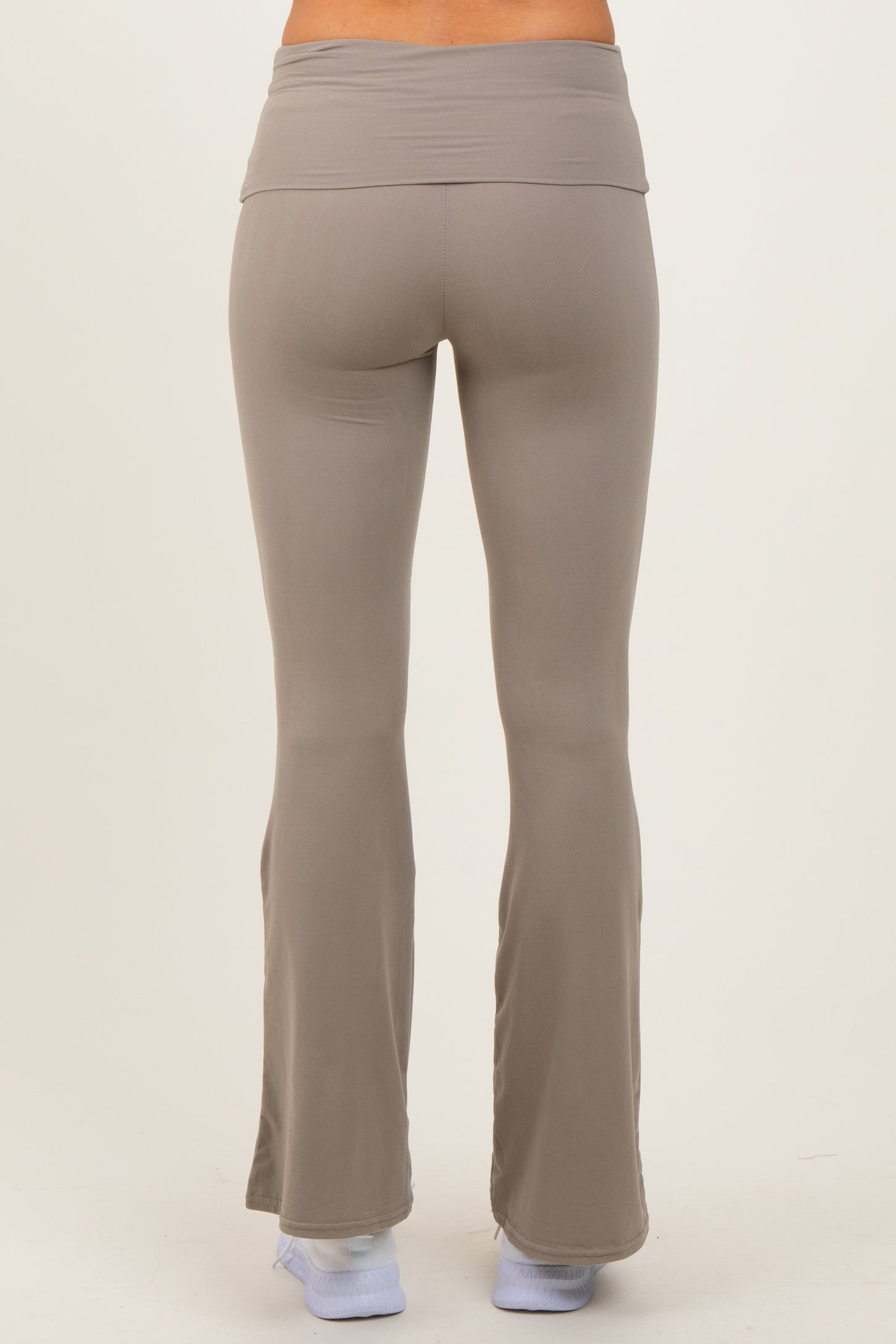 woman wearing light gray flared workout leggings viewed from the back
