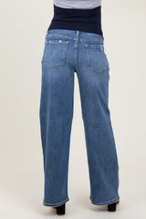 maternity wear light blue wide-leg jeans viewed from the back, featuring two back pockets and a relaxed fit