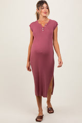 woman wearing a rose ribbed maternity dress with cap sleeves and side slits, showcasing her baby bump