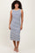 woman wearing a navy and white striped sleeveless midi dress with a fitted silhouette