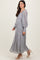 woman wearing a light gray long sleeve lace maxi dress with puff sleeves and a cinched waist