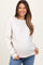 woman wearing a light beige maternity sweatshirt with ribbed side panels and a visible baby bump