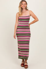 woman wearing a fitted striped maxi dress with pink, green, and white stripes and spaghetti straps