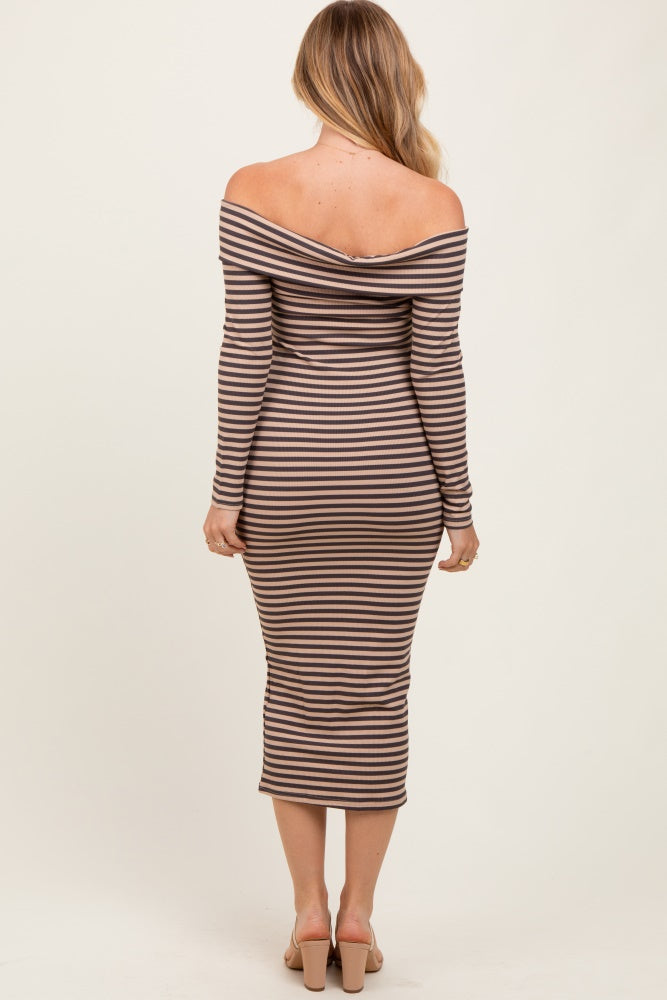 woman wearing a long-sleeve off-the-shoulder striped midi dress with a fitted silhouette and slit sleeves