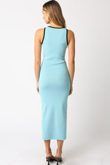 woman wearing a light blue ribbed midi dress with black straps, shown from the back