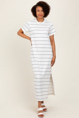 woman wearing a white striped maxi dress with short sleeves and side slits