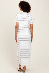 woman wearing a white striped maxi dress with short sleeves and side slits, viewed from the back