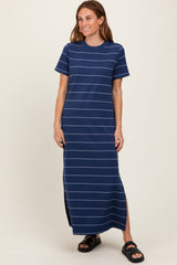 woman wearing a navy blue striped maxi dress with short sleeves and side slits