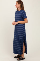 woman wearing a navy blue striped maxi dress with short sleeves and side slits