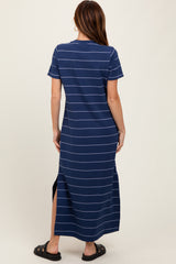 woman wearing a navy blue striped maxi dress with short sleeves and side slits