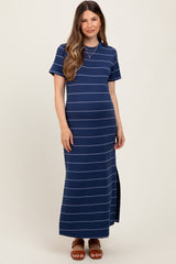woman wearing a navy blue striped maternity maxi dress with short sleeves and side slit