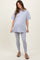 woman wearing a gray oversized t-shirt and gray leggings, showing her baby bump in maternity wear